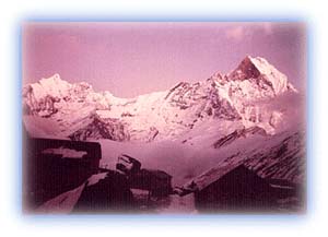 Annapurna Base Camp at dusk. The sacred Machhapuchhare peak stands to the right in the background. Credit: Scott Yost
